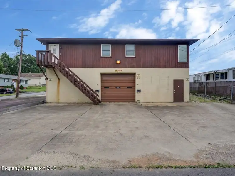 Mixed-use Property in Throop: 7-bay Garage and Updated 2-bedroom Apartment
