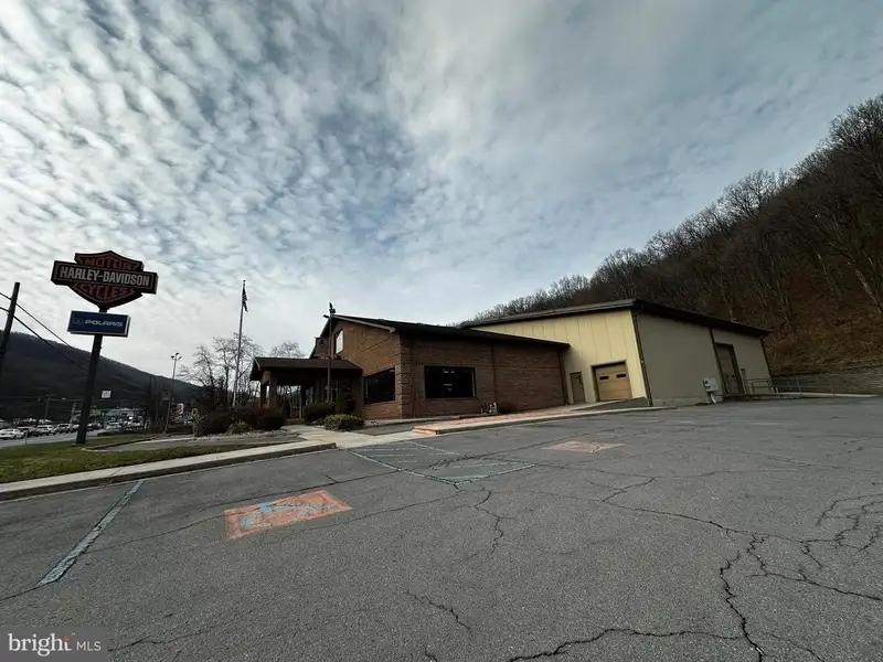 Versatile Commercial Property with Showroom, Offices, and Large Metal Building in Prime Location