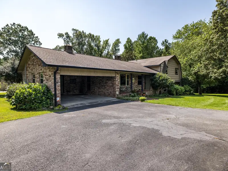 27 Acres with 2,400 Sq. Ft. Home, Duplexes, Pool, and Barn in Prime Location