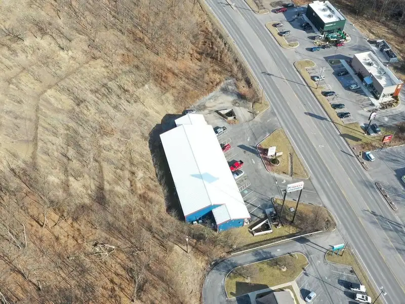 Versatile Commercial Property with Showroom, Offices, and Large Metal Building in Prime Location
