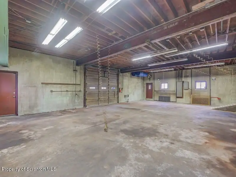 Mixed-use Property in Throop: 7-bay Garage and Updated 2-bedroom Apartment