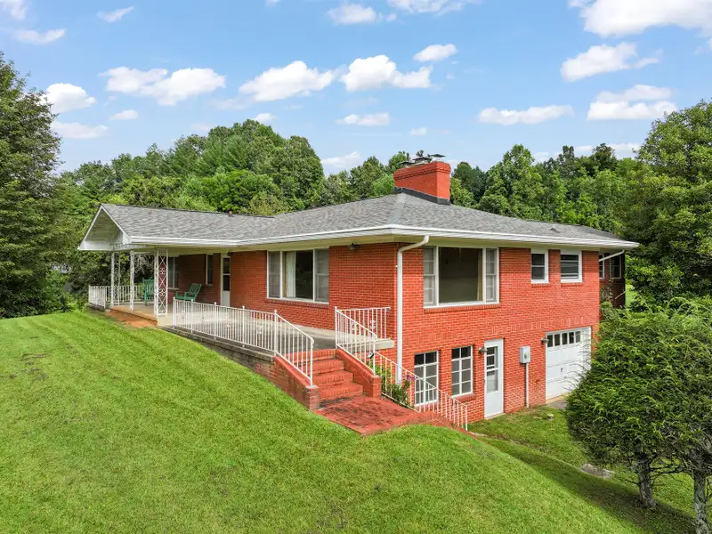 Prime 2.58-acre Multifunctional Property with Ranch Home and Outbuildings Near High-traffic Area