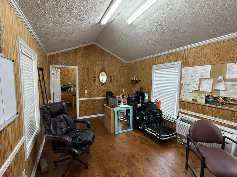 Prime Commercial Property with Office and Garage Space at Lake and East Main Intersection