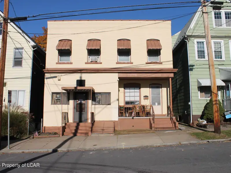 Mixed-use Building with Tavern and Apartments Plus Additional Parking Land