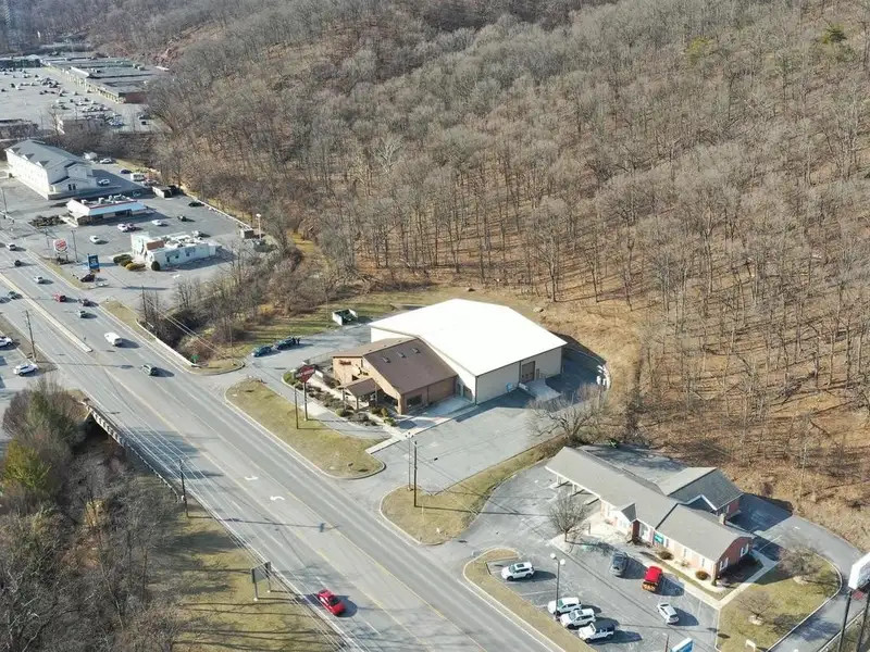 Versatile Commercial Property with Showroom, Offices, and Large Metal Building in Prime Location