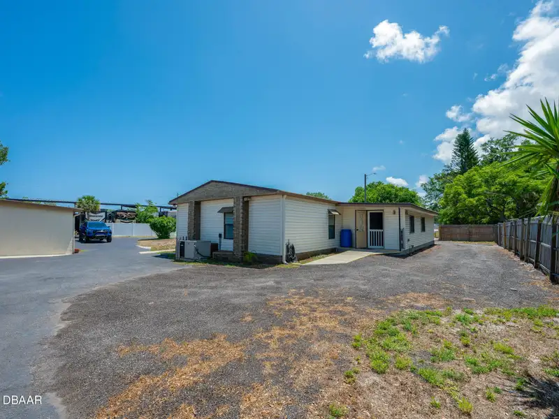 Mixed Use Property: Light Industrial Lot with Adjoining Residential Home and Expansion Potential