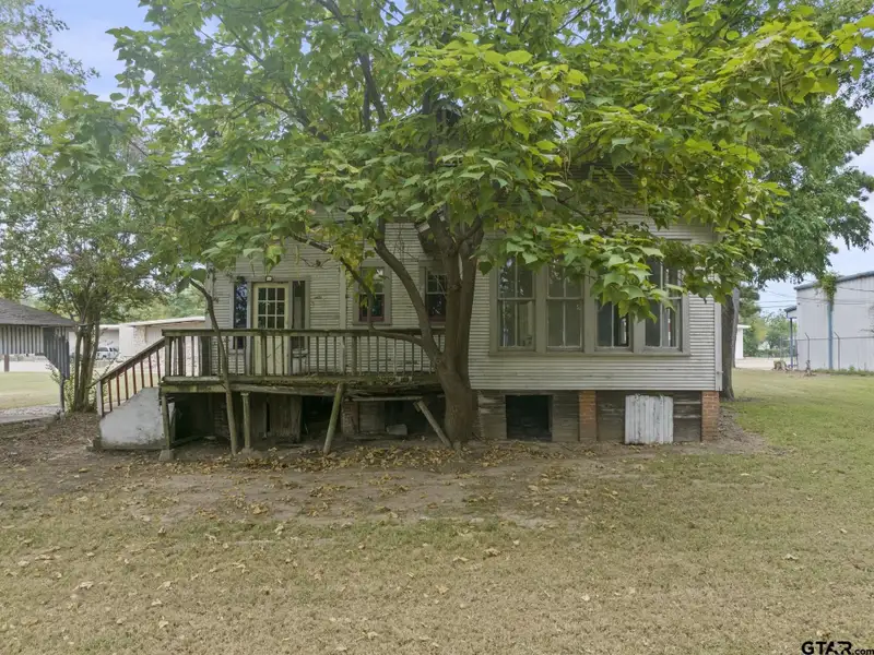 Prime Commercial Property with Building and Home on Half Acre Lot
