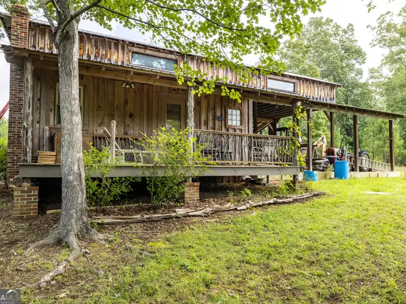 27 Acres with 2,400 Sq. Ft. Home, Duplexes, Pool, and Barn in Prime Location