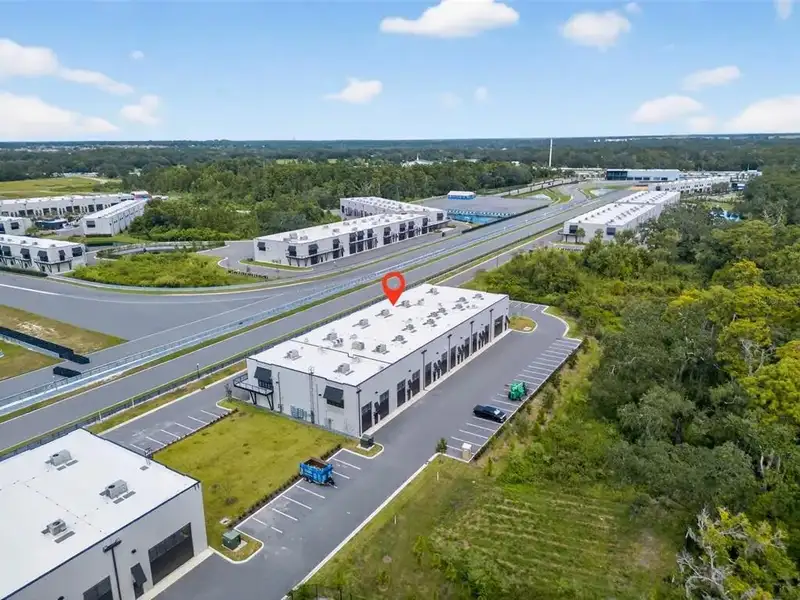 Exclusive Balcony Unit at the Motor Enclave with Private Garage and Racetrack Views