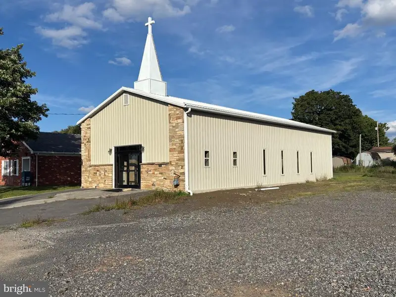 Versatile Metal Frame Building with Parking Lot in Prime Location, 0.33 Acres