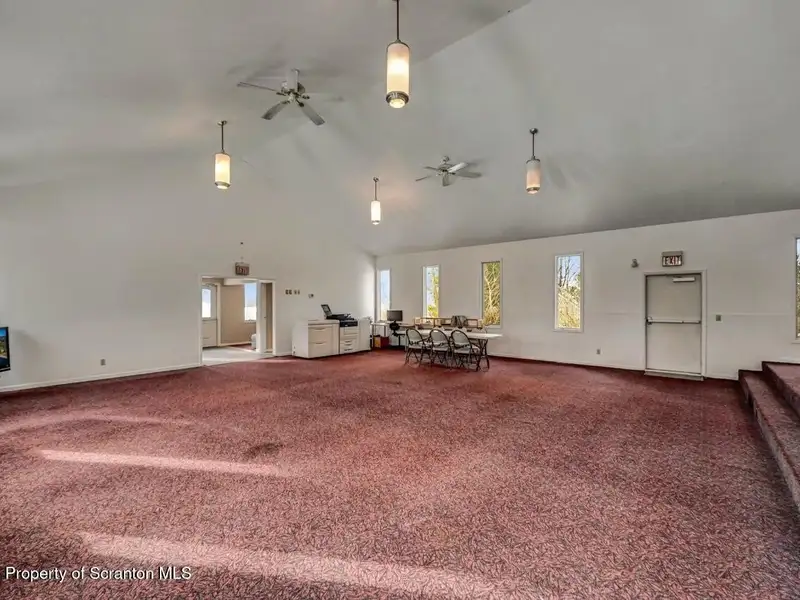 Versatile Former Church Building in Peaceful Location with Ample Parking and Creative Potential