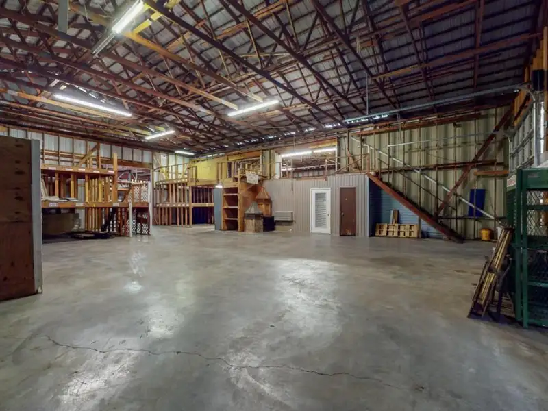 Commercial Property on Busy Highway - 2.1 Acres, 31,000 Sq Ft with Offices and Roll-up Doors