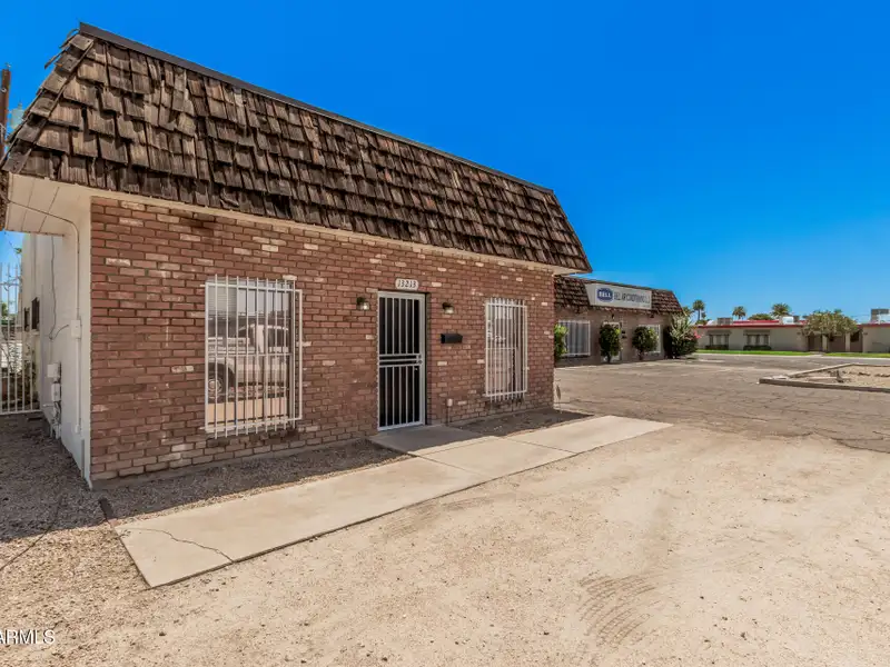 Versatile Commercial Property with Two Buildings and Ample Parking in Prime Location