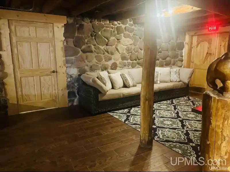 Full Log Home with Acreage, Pond, and Rental Income Near Ski Hills and Lake Superior