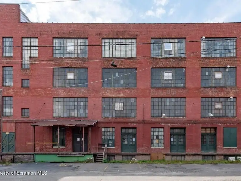 Four-story Commercial Property with Elevator Access and Basement in Prime Location