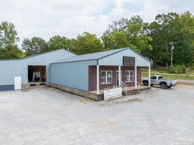 Large Commercial Building on Highway 412e in Parsons with Extensive Frontage and Warehouse Space