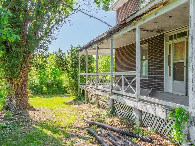 Classic American Foursquare Home in Need of Restoration with Detached Garage
