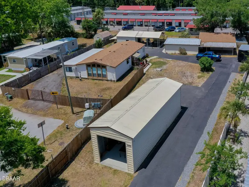 Mixed Use Property: Light Industrial Lot with Adjoining Residential Home and Expansion Potential