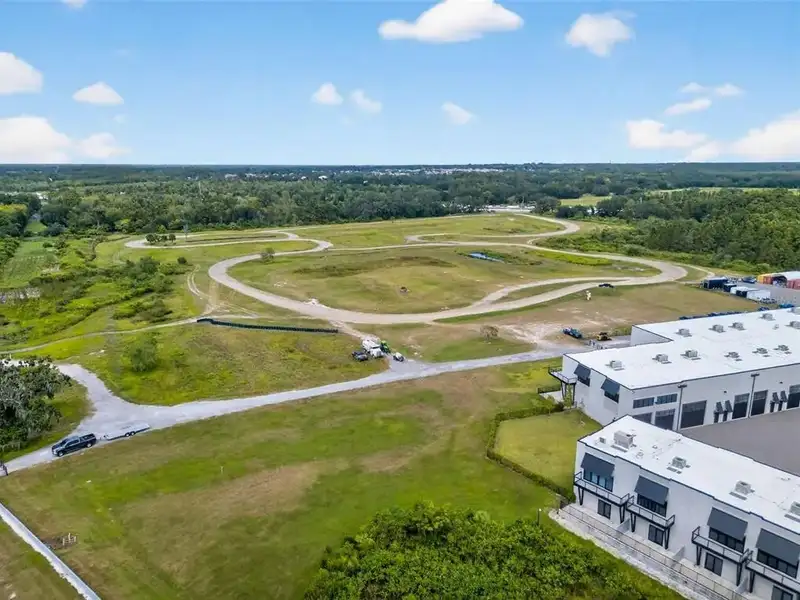 Exclusive Balcony Unit at the Motor Enclave with Private Garage and Racetrack Views