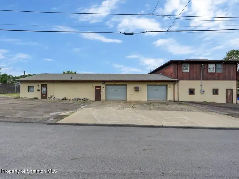 Mixed-use Property in Throop: 7-bay Garage and Updated 2-bedroom Apartment