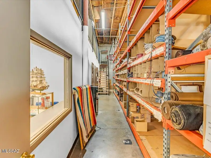 Versatile Commercial Warehouse with High Ceilings and Ample Parking in Prime Location