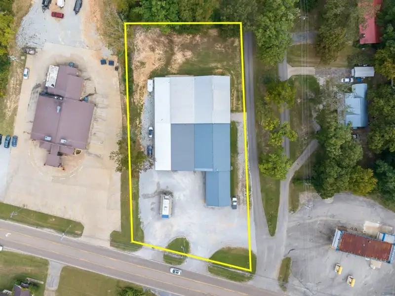 Large Commercial Building on Highway 412e in Parsons with Extensive Frontage and Warehouse Space