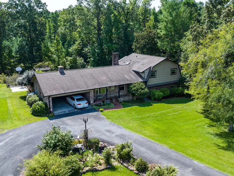 27 Acres with 2,400 Sq. Ft. Home, Duplexes, Pool, and Barn in Prime Location