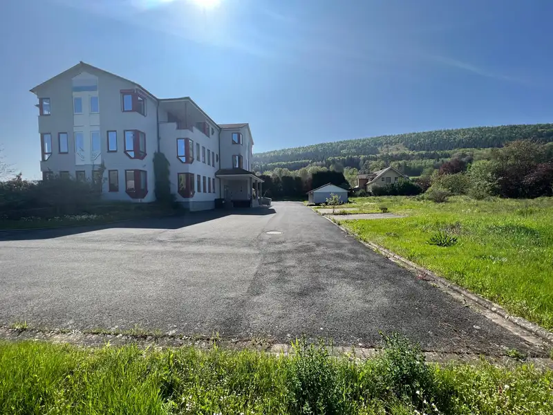 Versatile Company Building with Apartments, Offices, and Storage in Prime Location