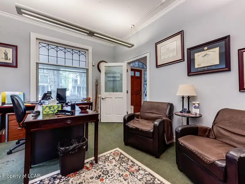 Versatile Office Building in Central Kingston with Multiple Offices and Ample Parking