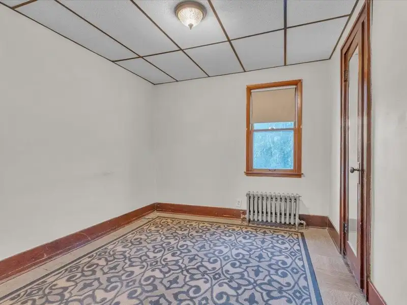 Versatile Corner Commercial Property with Retail Space and Two Apartments in Prime Location