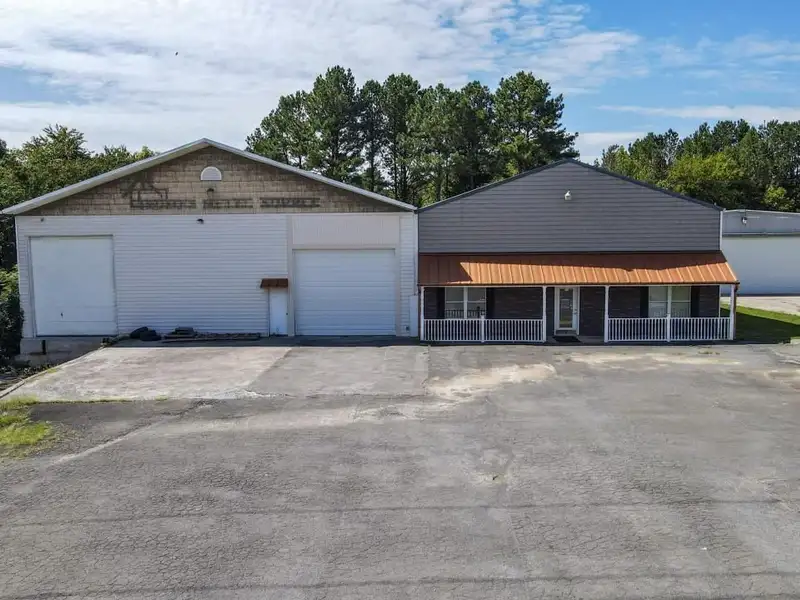 Commercial Property on Busy Highway - 2.1 Acres, 31,000 Sq Ft with Offices and Roll-up Doors