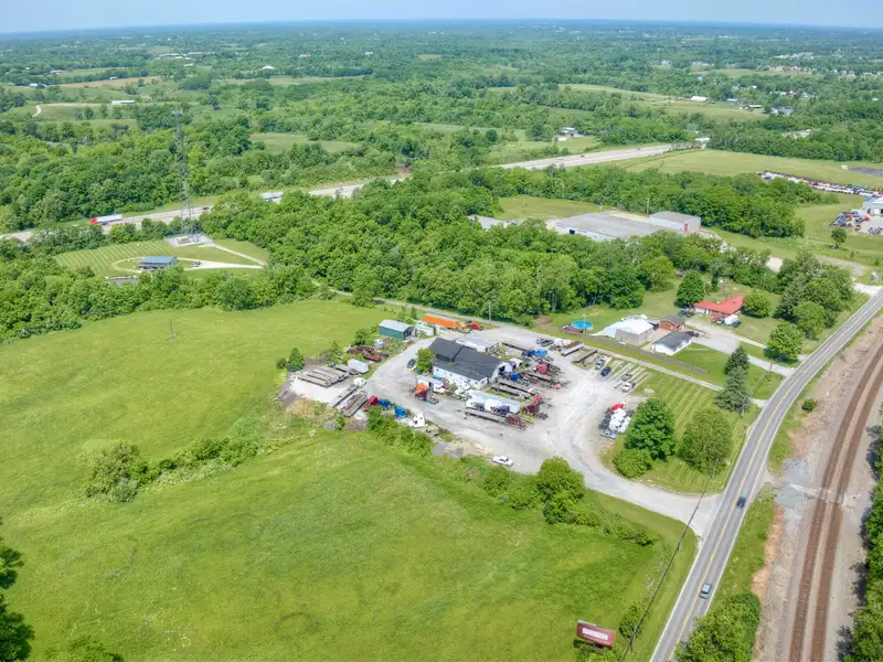 Commercial Property with 26 Acres on I-75, Includes Repair Shop and House