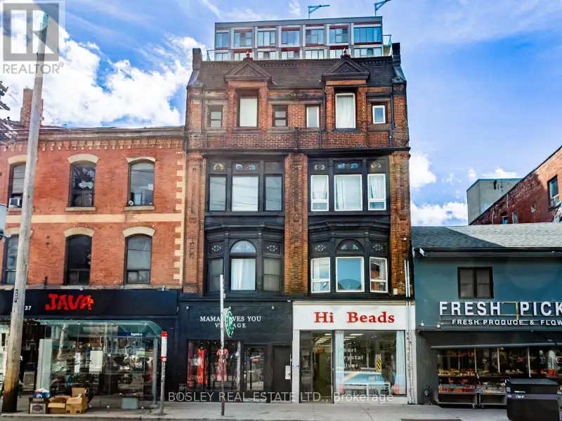 Charming Two-storey Apartment in Landmark Building on Queen St West