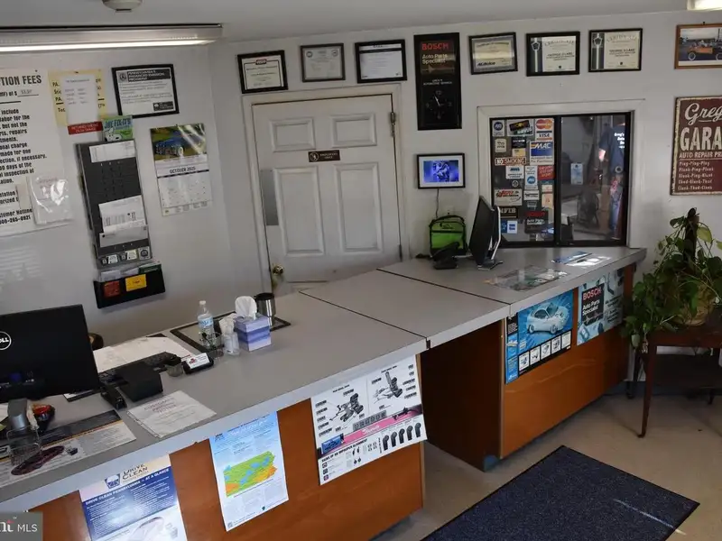 Versatile 3000+ Sq Ft Commercial Space in Prime Village Location with Auto Repair Facilities