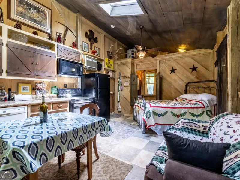27 Acres with 2,400 Sq. Ft. Home, Duplexes, Pool, and Barn in Prime Location