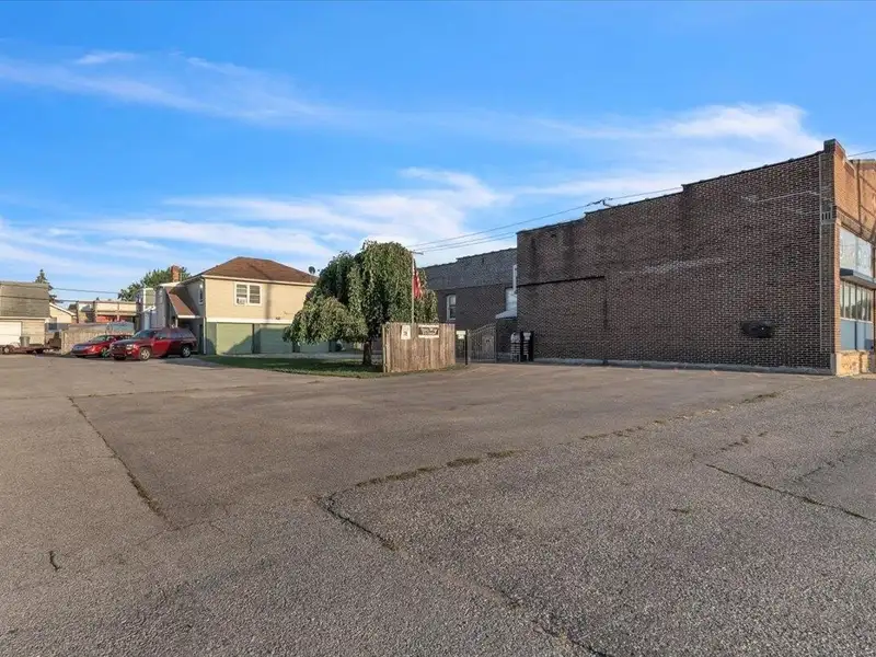 Versatile Corner Commercial Property with Retail Space and Two Apartments in Prime Location