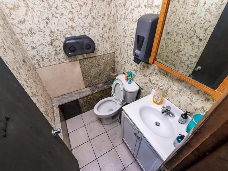 Mixed-use Property with 1-bedroom Apartment in Well-maintained Building
