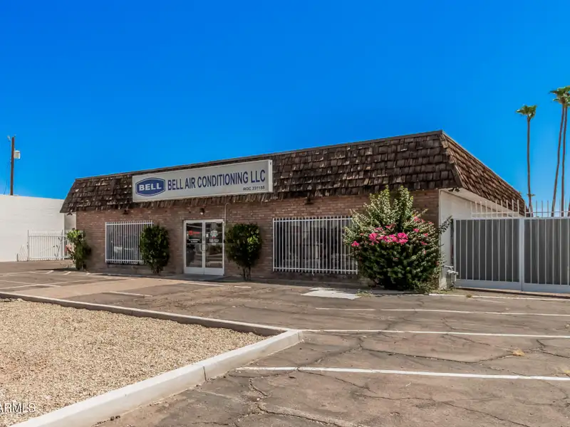 Versatile Commercial Property with Two Buildings and Ample Parking in Prime Location