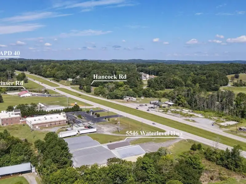 Commercial Property on Busy Highway - 2.1 Acres, 31,000 Sq Ft with Offices and Roll-up Doors