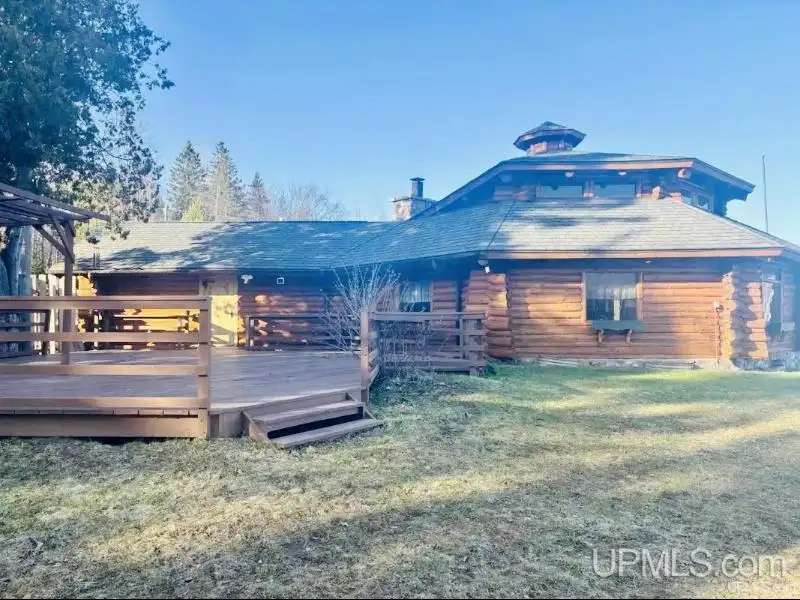 Full Log Home with Acreage, Pond, and Rental Income Near Ski Hills and Lake Superior