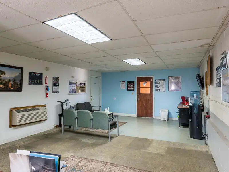 Mixed-use Property with 1-bedroom Apartment in Well-maintained Building