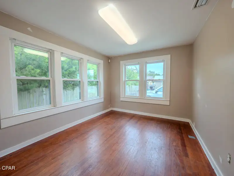 Versatile Commercial Property on Jenks Avenue with Two Buildings and Outdoor Space
