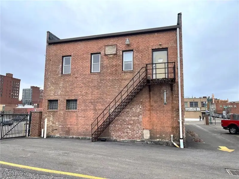 Well-maintained Two-story Brick Building with Retail and Workshop Space in Ne Location