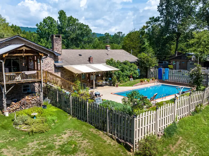 27 Acres with 2,400 Sq. Ft. Home, Duplexes, Pool, and Barn in Prime Location