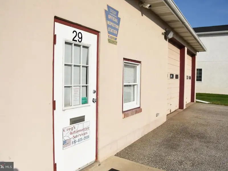 Versatile 3000+ Sq Ft Commercial Space in Prime Village Location with Auto Repair Facilities