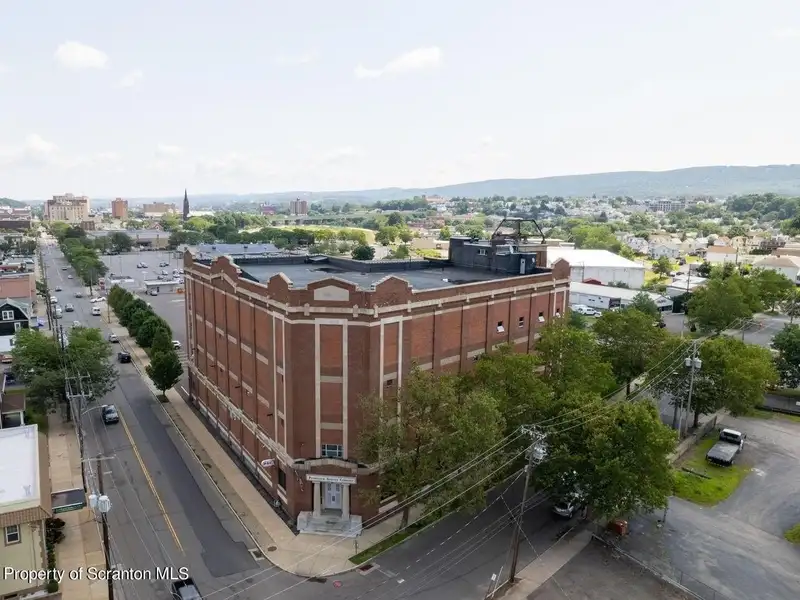 Landmark 4-story Commercial Building on 3 Acres with Warehouse and Office Space