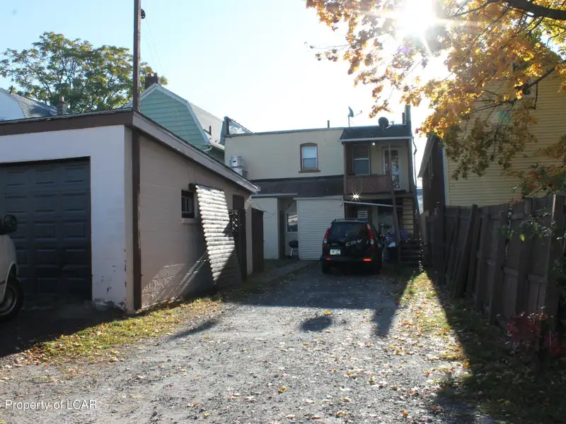 Mixed-use Building with Tavern and Apartments Plus Additional Parking Land