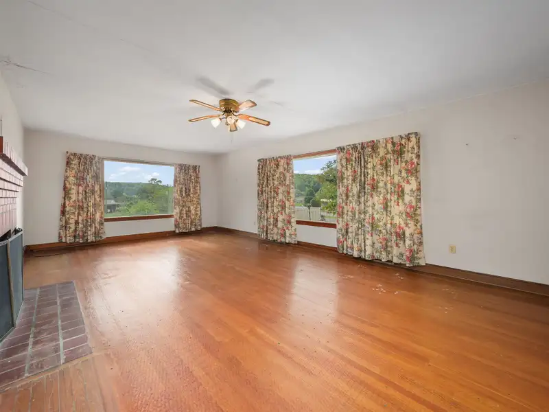 Prime 2.58-acre Multifunctional Property with Ranch Home and Outbuildings Near High-traffic Area