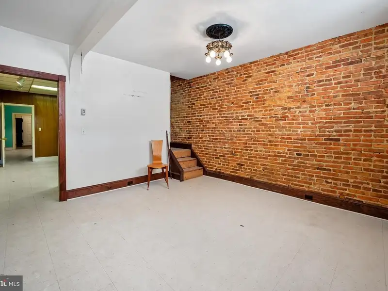 Multi-story Mixed-use Property with Apartment Potential in Prime Location