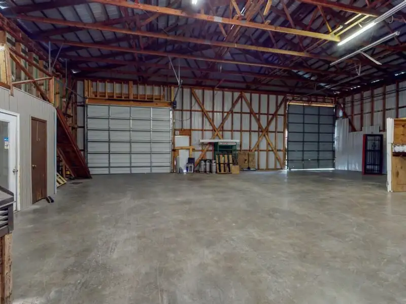 Commercial Property on Busy Highway - 2.1 Acres, 31,000 Sq Ft with Offices and Roll-up Doors